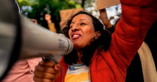 A person with a megaphone at a protest